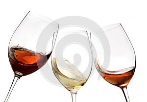 Toasting gesture red and white wine with splash, cheers close up with wine isolated
