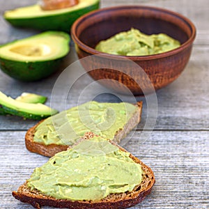 Toasts with avocado guacamole, Diet breakfast. Delicious and healthy plant-based food. Top view