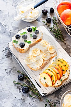 Toasts with berries and fruits. Healthy breakfast concept. Simple and tasty food