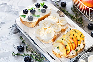 Toasts with berries and fruits. Healthy breakfast concept. Simple and tasty food