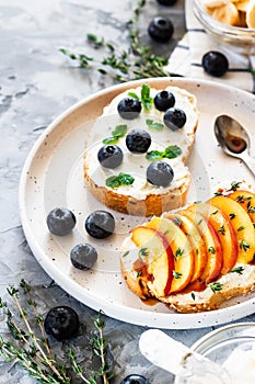 Toasts with berries and fruits. Healthy breakfast concept. Simple and tasty food