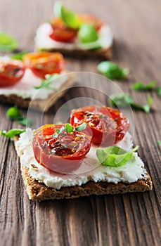 Toasts (Crostini) with ricotta and cherry tomatoes