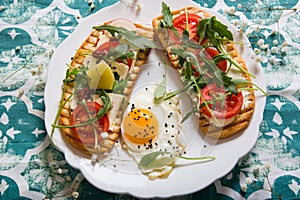 Toasts with egg, aragula, tomato and cheese,French toast bread with veggies