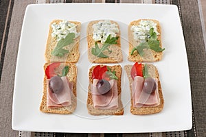 Toasts with ham and cucumber dip