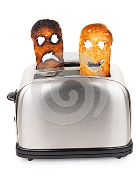 Toasts with smiley face in toaster