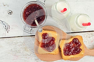 Toasts with strawberry jam and milk