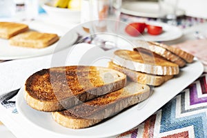 Toasts on a table set for breakfast or dinner