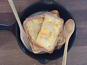 Toasts topped with Condensed milk on table