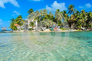 Tobacco Caye - Relaxing at Cabin or bungalow on small tropical island at Barrier Reef with paradise beach, Caribbean Sea, Belize,
