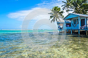 Tobacco Caye - Relaxing at Cabin or bungalow on small tropical island at Barrier Reef with paradise beach, Caribbean Sea, Belize,