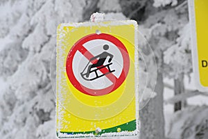 Tobogganing or sledging ban sign photo