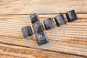 TODAY NOW wrote with keyboard keys on wooden background