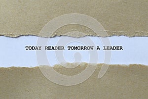 today reader tomorrow a leader on white paper photo
