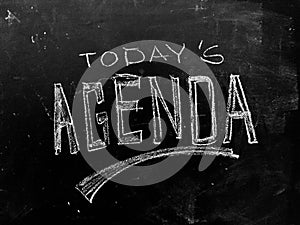 Today`s Agenda Handwritten on Blackboard