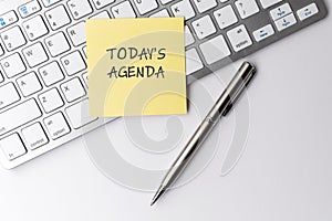 Today`s agenda text on sticky note photo