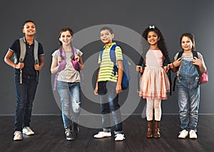 Today is the start of something new. Studio portrait of a diverse group of kids carrying their school backpacks against