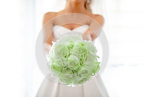 Today is wedding day! Bride with bouquet of gresh green roses