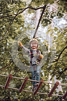 Toddler age. Balance beam and rope bridges. Carefree childhood. Kids boy adventure and travel. Artworks depict games at