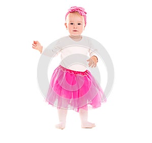 Toddler baby girl in pink tutu skirt