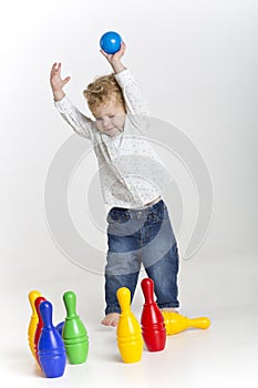 Toddler is bowling