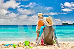 Toddler boy on beach with father