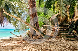 Toddler boy on beach with mother