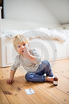 Toddler boy in a dangerous situation at home.