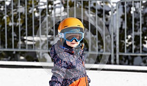 Toddler Boy Dressed Warmly & in Good Safety Gear Ready to go Ski