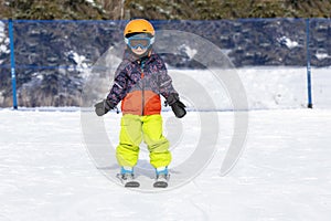 Toddler Boy Dressed Warmly & in Good Safety Gear Ready to go Ski