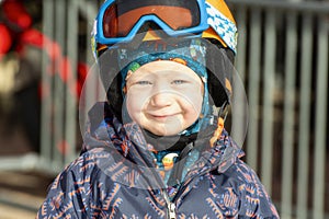 Toddler Boy Dressed Warmly & in Good Safety Gear Ready to go Ski