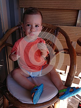 Toddler boy eating strawberries