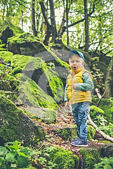 Toddler boy hiking in mountains