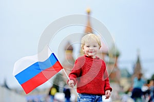 Toddler boy holding russian flag