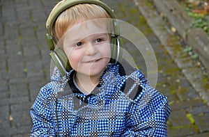 Toddler boy listening to music