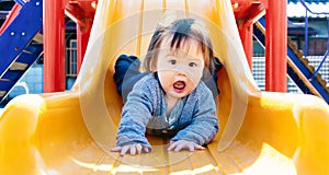 Toddler boy playing on the playground