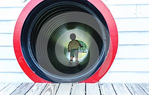 Toddler boy playing at a playground