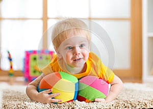 Toddler boy playing with toys indoor