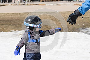 Toddler Boy Ready to Ski Dressed for Safety with Helmet & Harness