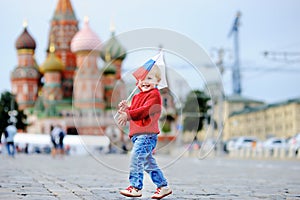 Toddler boy running with russian flag