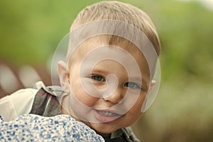 Toddler boy smiling with baby teeth on cute face