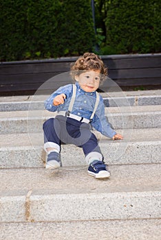 Toddler boy trying to descend stairs