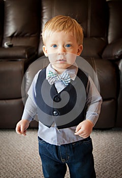 Toddler boy wearing bow tie and suit vest