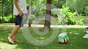 Toddler and brother playing with ball. Parents spending time with children