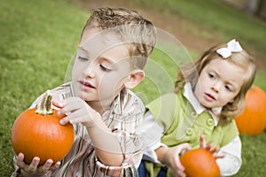 Toddler Brother and Sister At the Pumpkin Patch