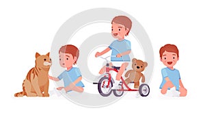 Toddler child, little boy riding tricycle, playing with pet cat