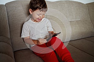 Toddler communicates via video conference using a smartphone photo