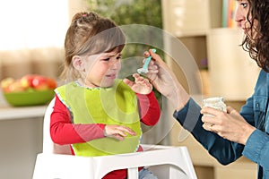 Toddler crying at lunch time photo