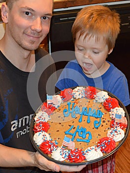 Toddler and Daddy with giant Independence Day Cookie