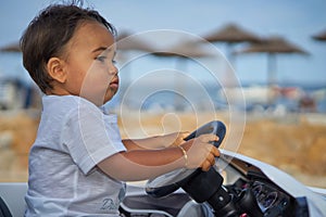 Toddler Driving Car by Beach