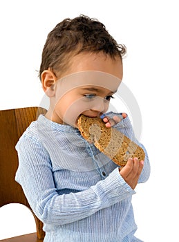 Toddler eating bread